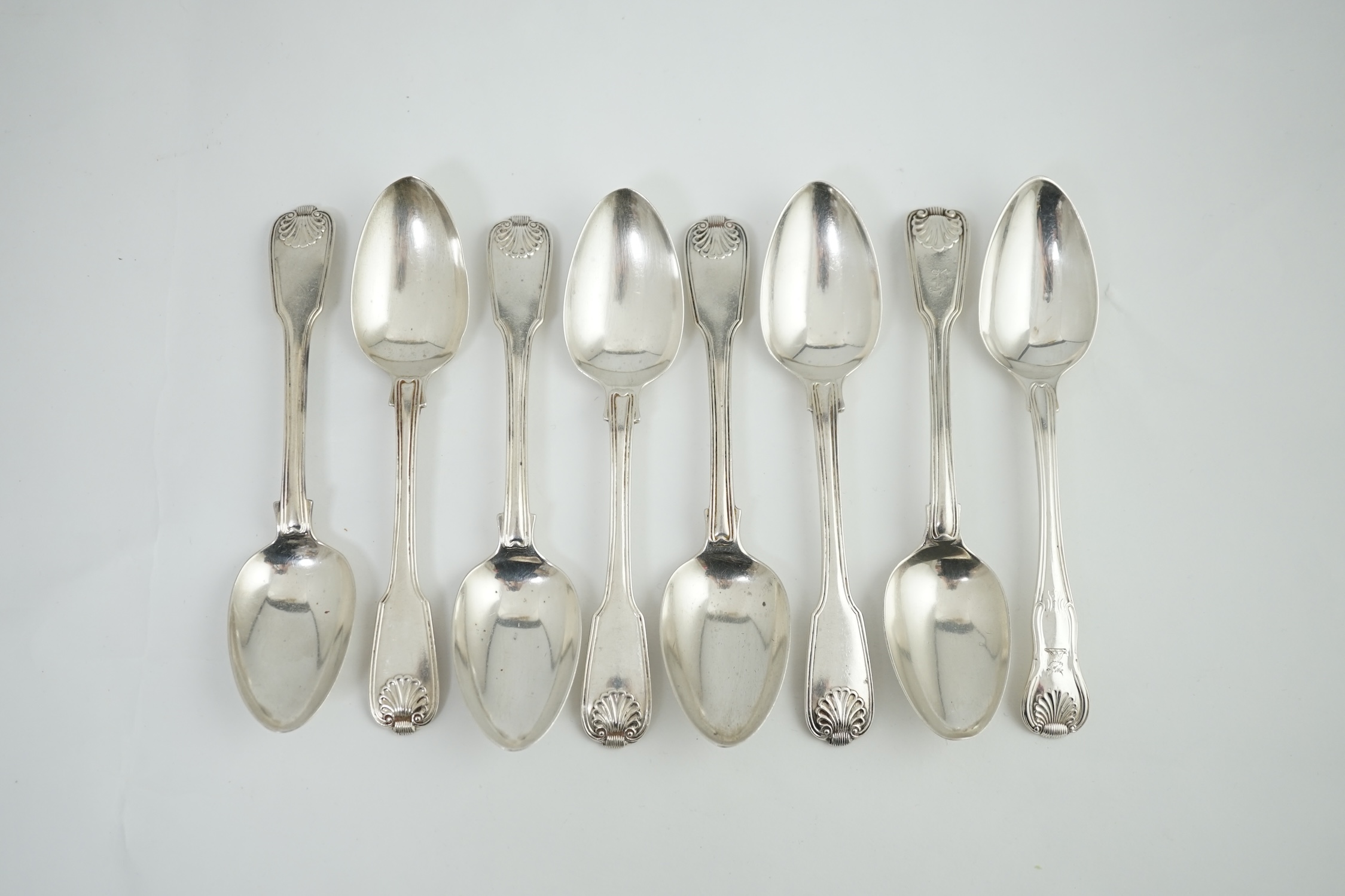 A set of seven George IV silver fiddle, thread and shell pattern dessert spoons, by Francis Higgins II, London, 1826 and another 1789